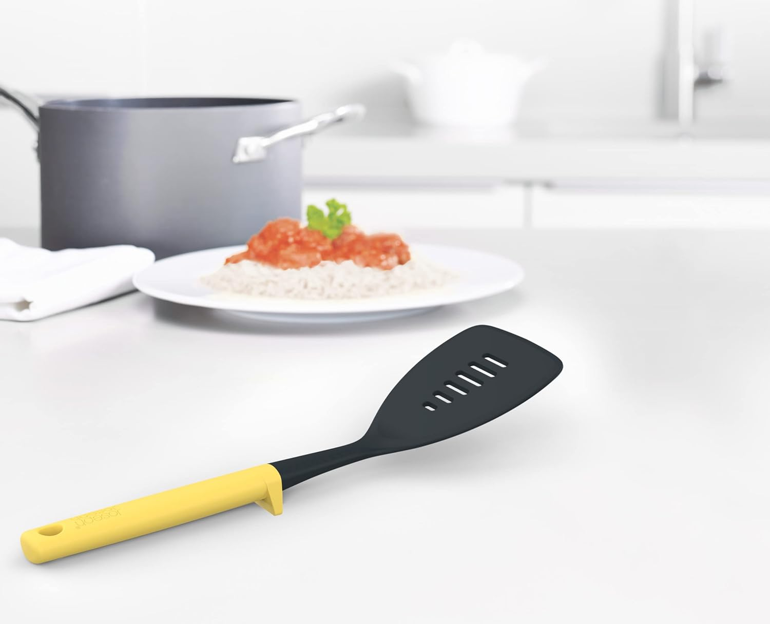 Joseph Joseph Duo Slotted Turner with Integrated Tool Rest: Hygienic, Heat-Resistant Nylon Head, Safe for Non-Stick Cookware, Light Yellow image number 1