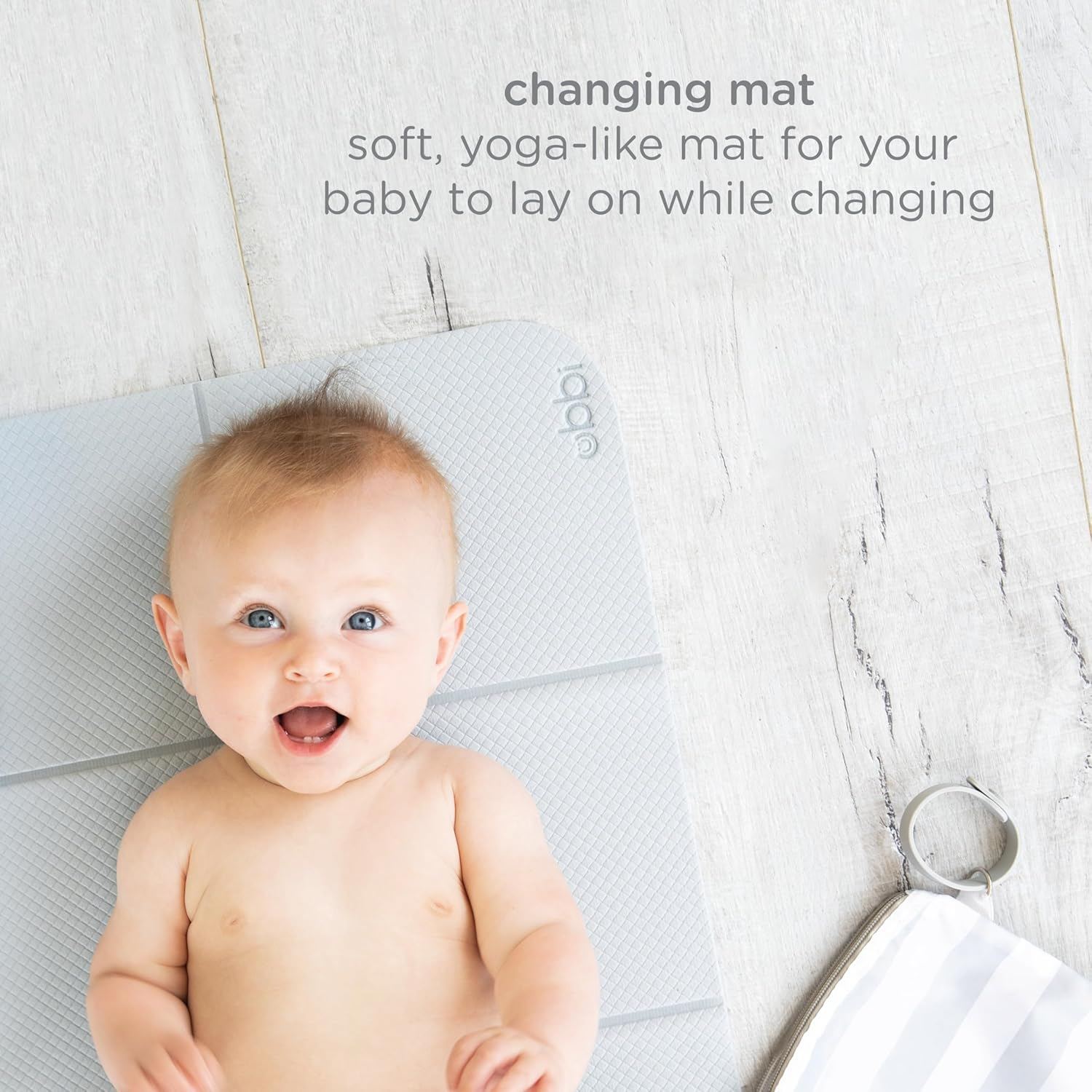Ubbi On-The-Go Changing Mat with Carrying Bag, Soft and Comfortable Diaper Bag Accessory Must Have for Newborns, Easy to Clean, Portable Changing Pad, Gray image number 3