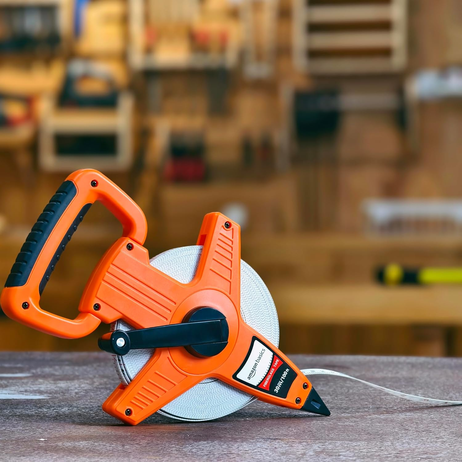 Amazon Basics Open Reel Fiberglass Tape Measure, 100-Feet (30-Meters) by 1.27 CM, Inch/Metric Scale, Impact Resistant Shell, Orange image number 2