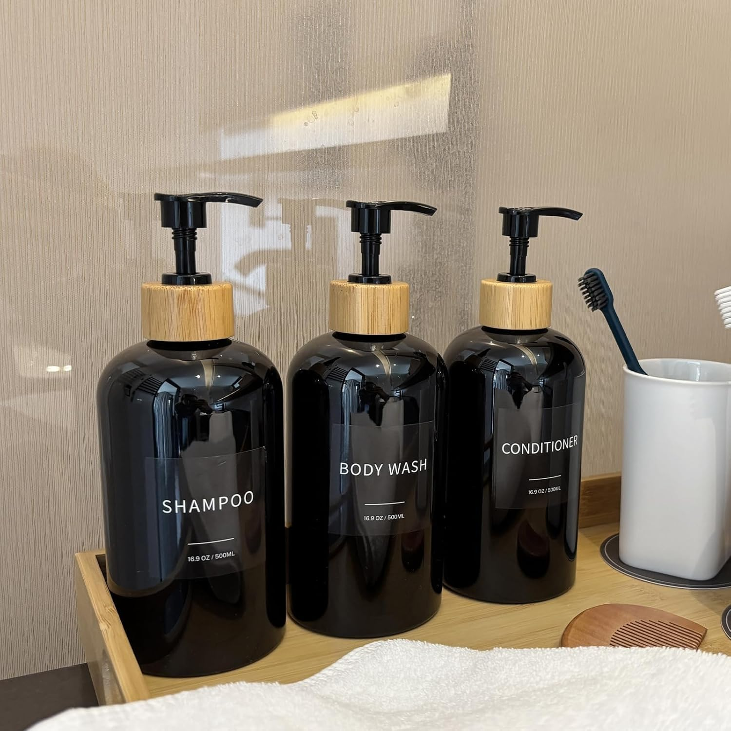 Shampoo and Conditioner Dispenser, Refillable Plastic Shampoo Pump Bottles with Waterproof Labels, Empty Body Wash Dispenser Set for Bathroom, Shower Soap Bottles (Black, Set of 3, 16.9Oz) image number 1