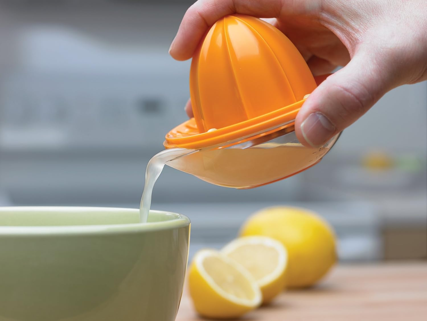 Progressive Citrus Juicer with Strainer for Pulp & Seeds - Multifunctional Measuring Cup | Easy-Pour Spout | Ideal Size to Fit Limes, Lemons and Small Oranges | 1/2 Cup, 8TBSP or 120Ml | Orange/Clear image number 6