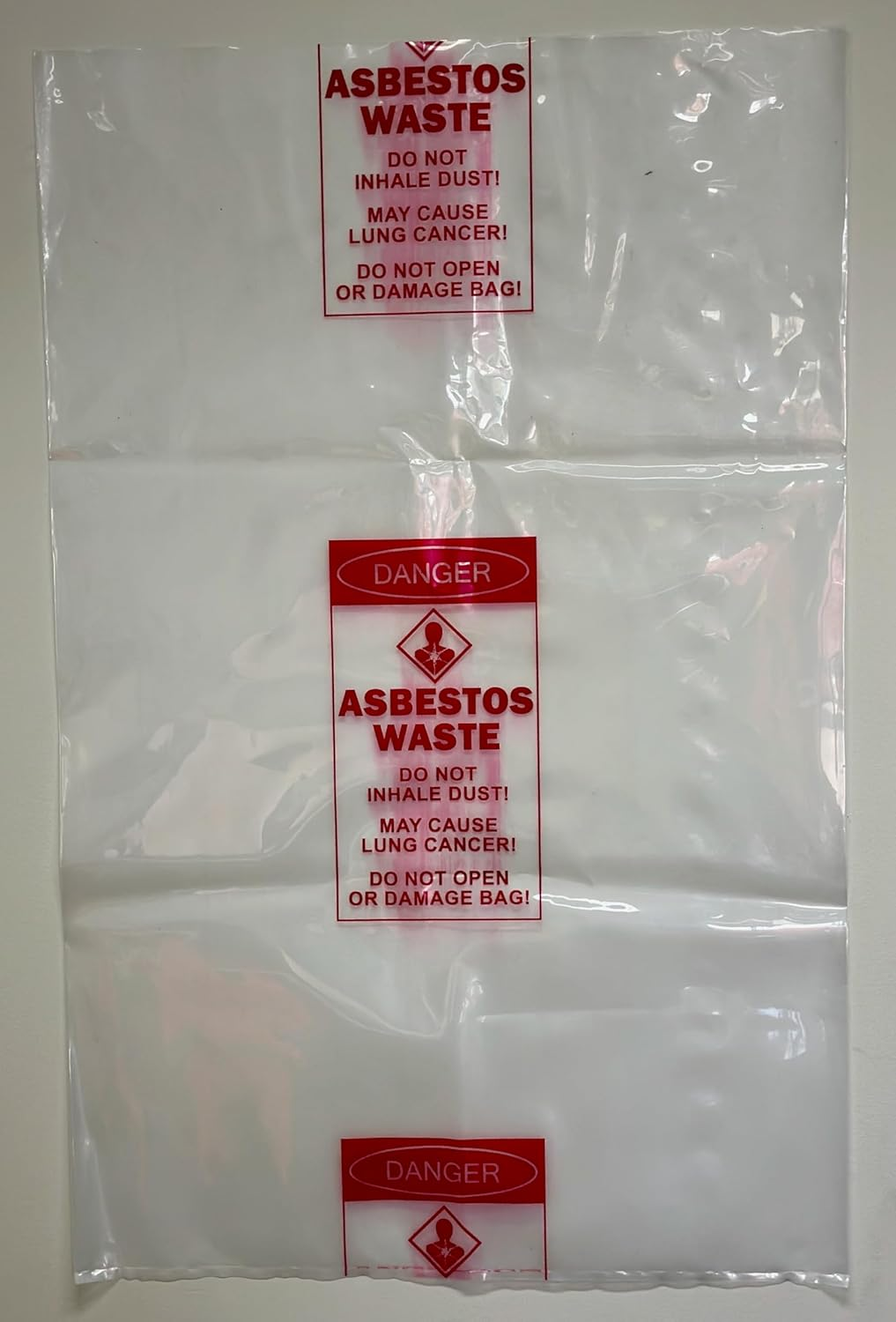 Pacific Bags Australia Medium Clear Asbestos Waste Bags &ndash; 700 Mm X 1100 Mm, 200 &Mu;m Virgin Low Density Polyethylene, Warning Labelled, 50 Bags per Carton (1 Roll) image number 1
