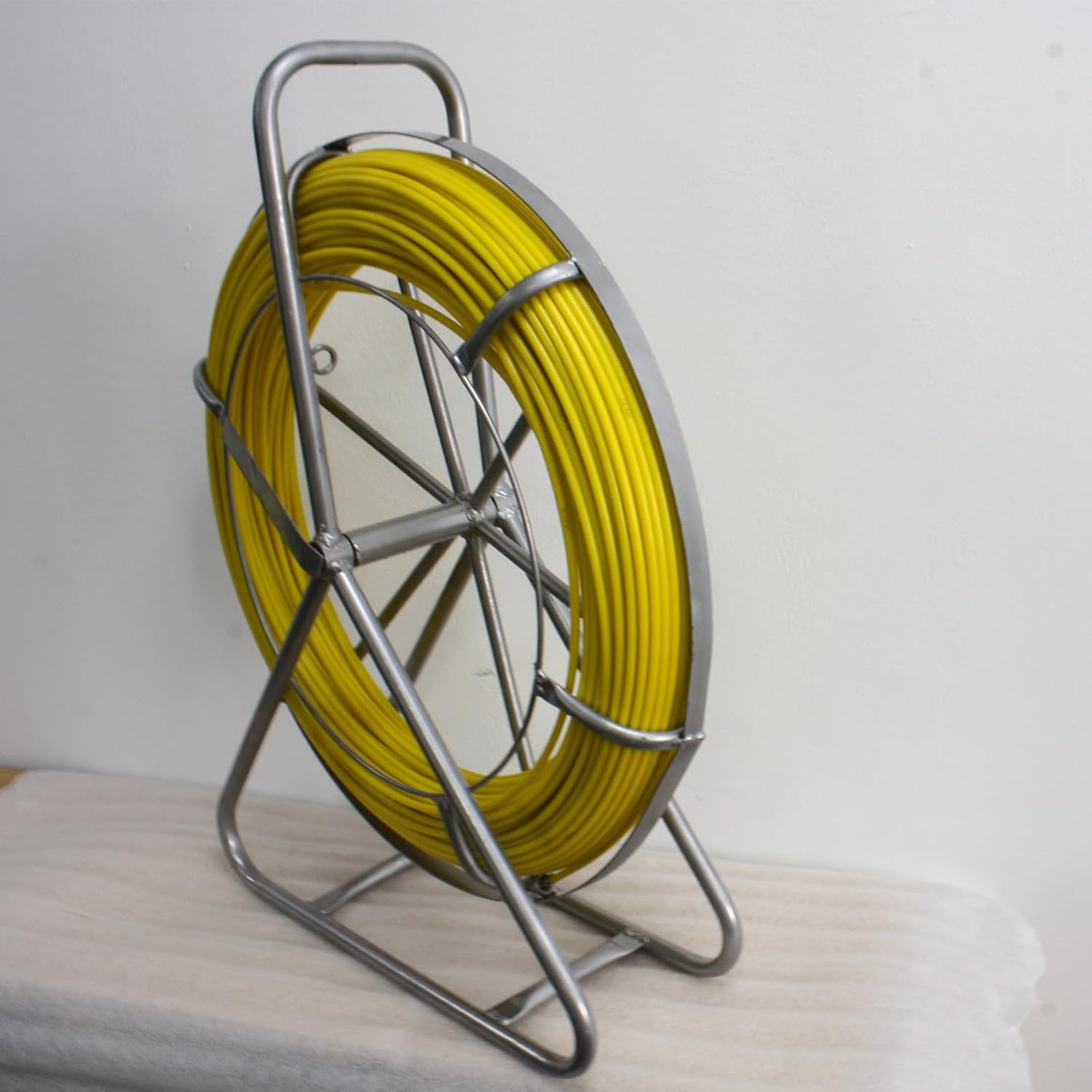 Acbbmns Fiberglass Fish Tape Cable Puller, 6Mm X 130M Fiberglass Wire Cable Running Rod Duct Rodder Puller with Brake and Steel Reel Stand