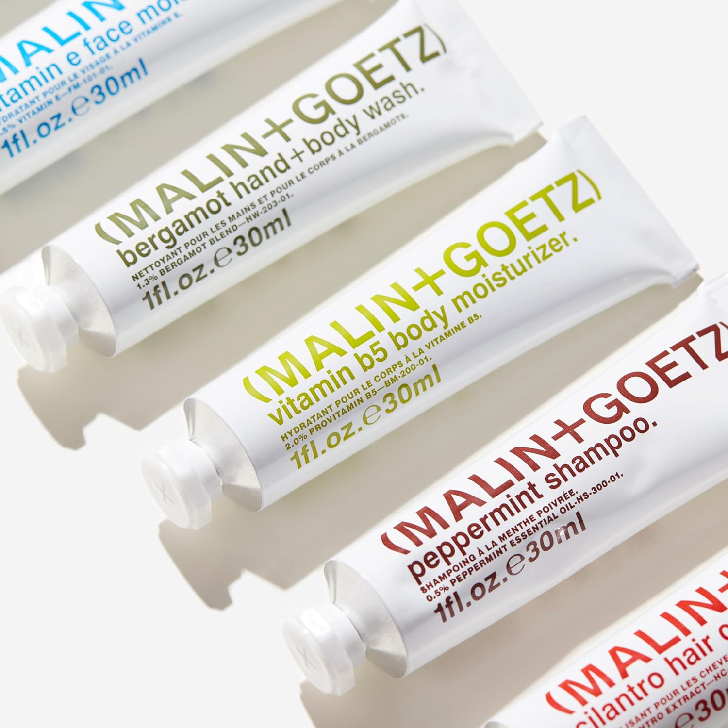 Malin + Goetz Essential Starter Kit- Including Hair Shampoo & Conditioner, Facial Cleanser & Moisturizer, Body Wash & Moisturizer, All Natural Ingredients, All Skin Types, Cruelty-Free, Vegan image number 1