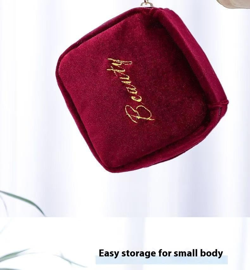 A Portable Beauty Companion This Burgundy Suede Hanging Bag Effortlessly Holds Items Such as Lipsticks and Earrings. image number 2