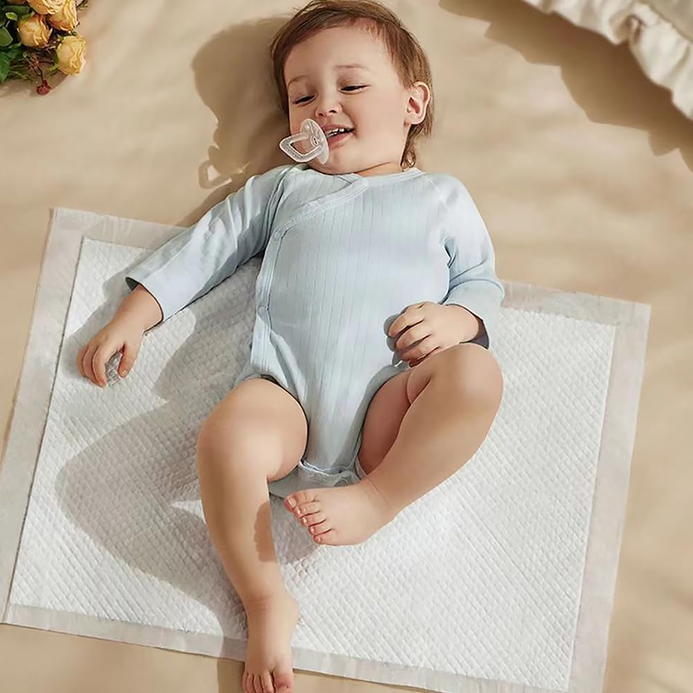 Zdolmy Disposable Changing Pad Liners (100 Pack) Super Soft, Ultra Absorbent & Waterproof - Covers Any Surface for Mess Free Baby Diaper Changes (White)