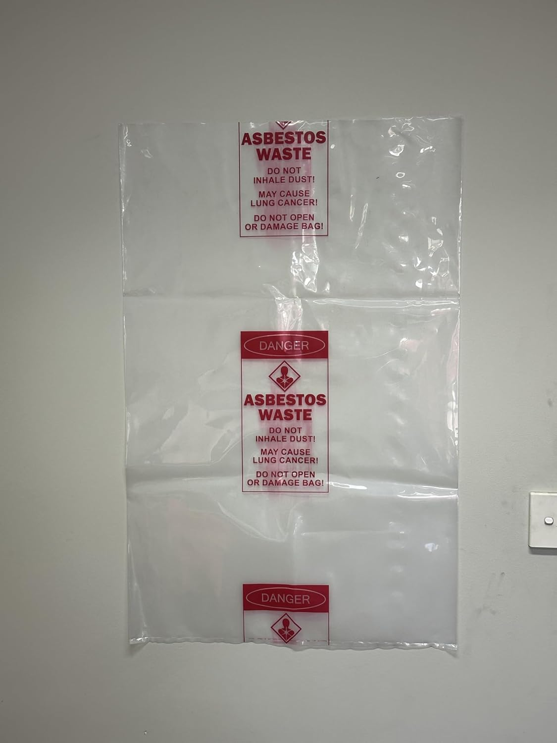 Pacific Bags Australia Medium Clear Asbestos Waste Bags &ndash; 700 Mm X 1100 Mm, 200 &Mu;m Virgin Low Density Polyethylene, Warning Labelled, 50 Bags per Carton (1 Roll) image number 3