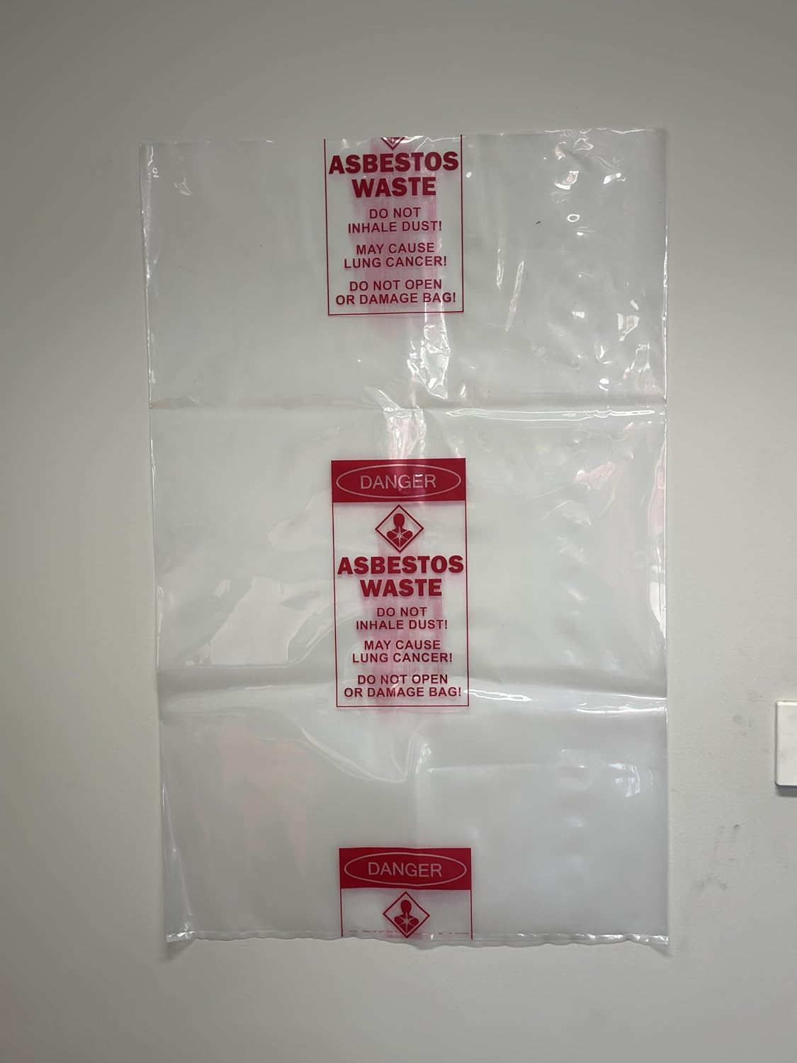 Pacific Bags Australia Medium Clear Asbestos Waste Bags &ndash; 700 Mm X 1100 Mm, 200 &Mu;m Virgin Low Density Polyethylene, Warning Labelled, 50 Bags per Carton (1 Roll) image number 2