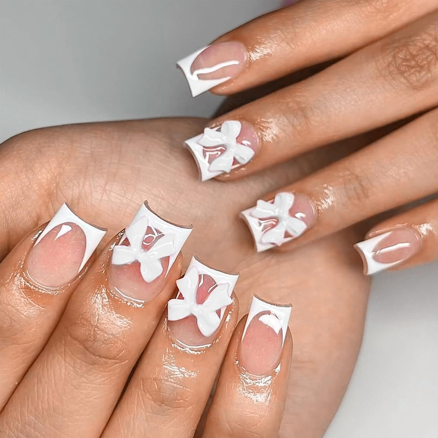 Qioon 24 Pcs Pink Press on Nails Short Square, Glossy Nude Pink Full Cover Fake Nails with White French Tips and Bow Charms, Cute False Nail for Women and Girls, Daily Manicure Set