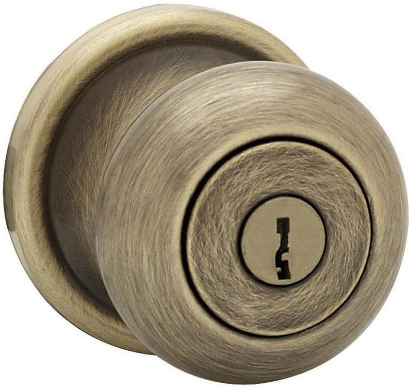 Kwikset Juno Entry Knob Featuring Smartkey in Antique Brass