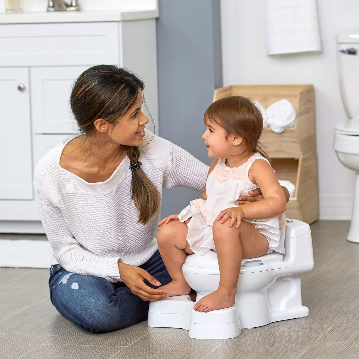 The First Years Super Pooper Potty Training Toilet plus Potty Seat with Foot Rest &mdash; White &mdash; 2-In-1 Toddler Toilet Seat and Potty Chair image number 1