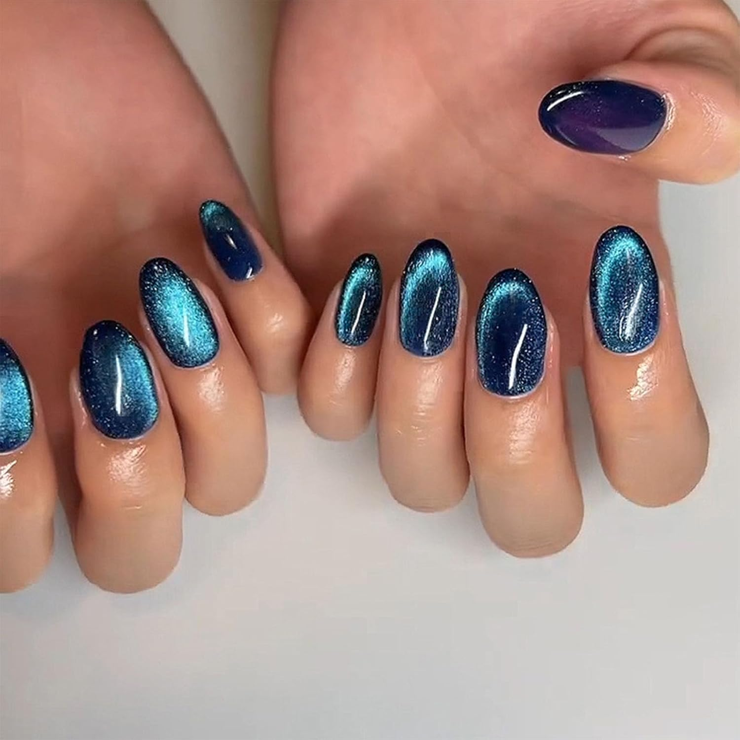 Xenophoer Short Press on Nails Oval Blue Cat Eye Fake Nails Acrylic Glue on Nails with Silver Glitter Designs Nails Press Ons for Women Daily Wear 24 Pcs