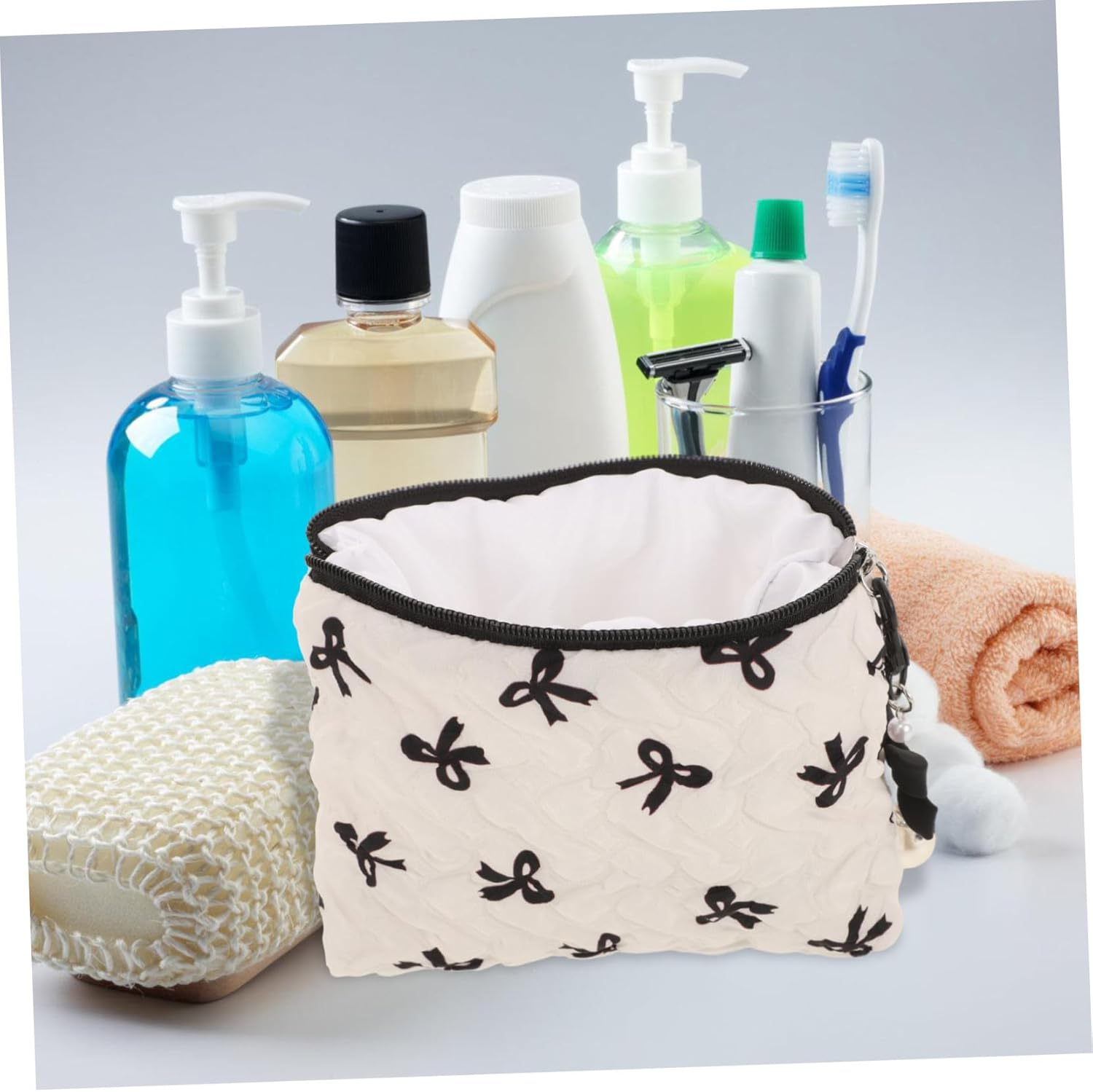 FINISPERSOO Embossed Bow Small Makeup Bag with Wrinkle Design, Portable Cosmetic Organizer Pouch for Women, Cute Toiletries Holder for Travel and Daily Use, Black Bow Detail image number 4