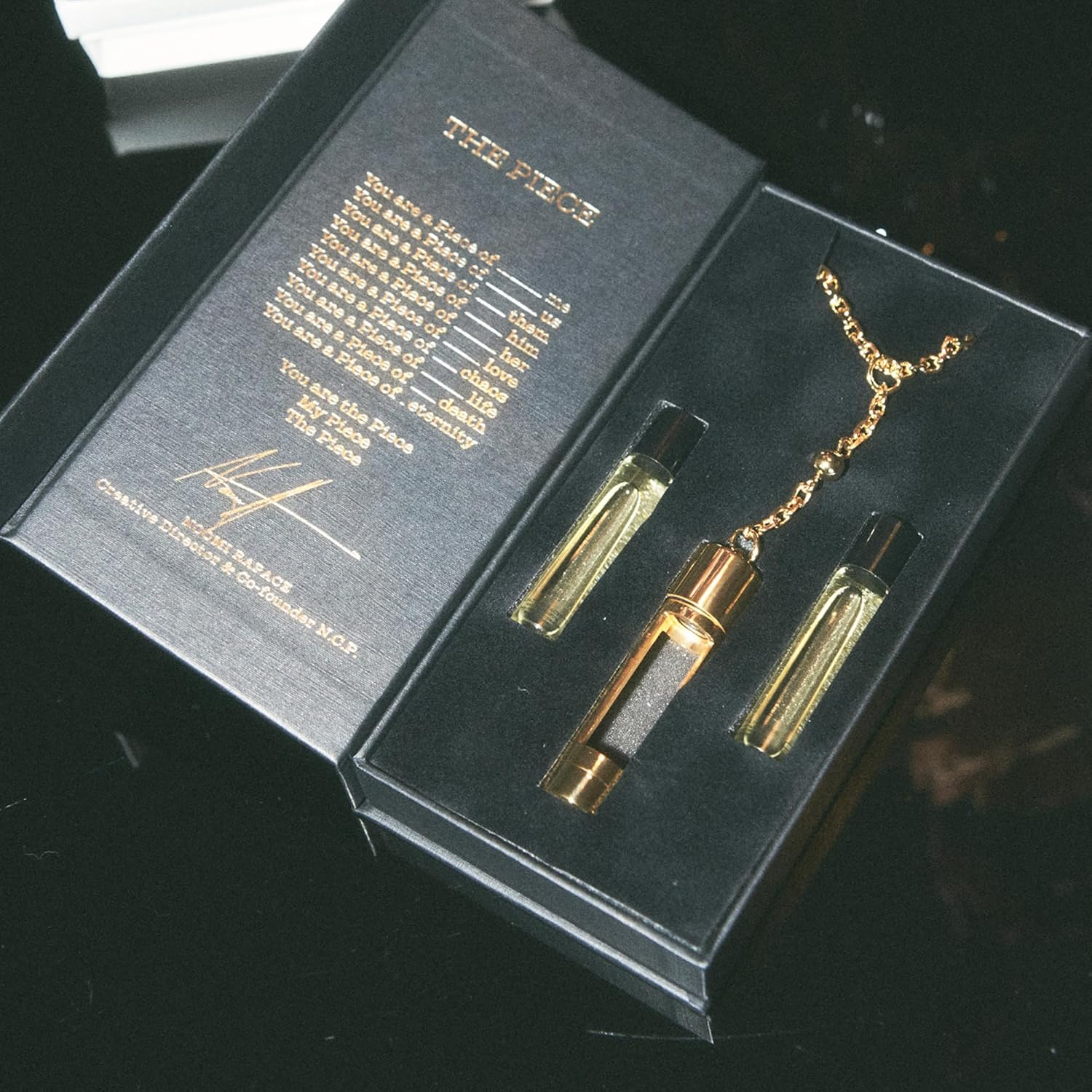 The Piece - Gold by NCP for Unisex - 3 Pc 2 X 4.9Ml Olfactive Facet -701 Leather and Vetiver EDP Roll On, Necklace image number 2