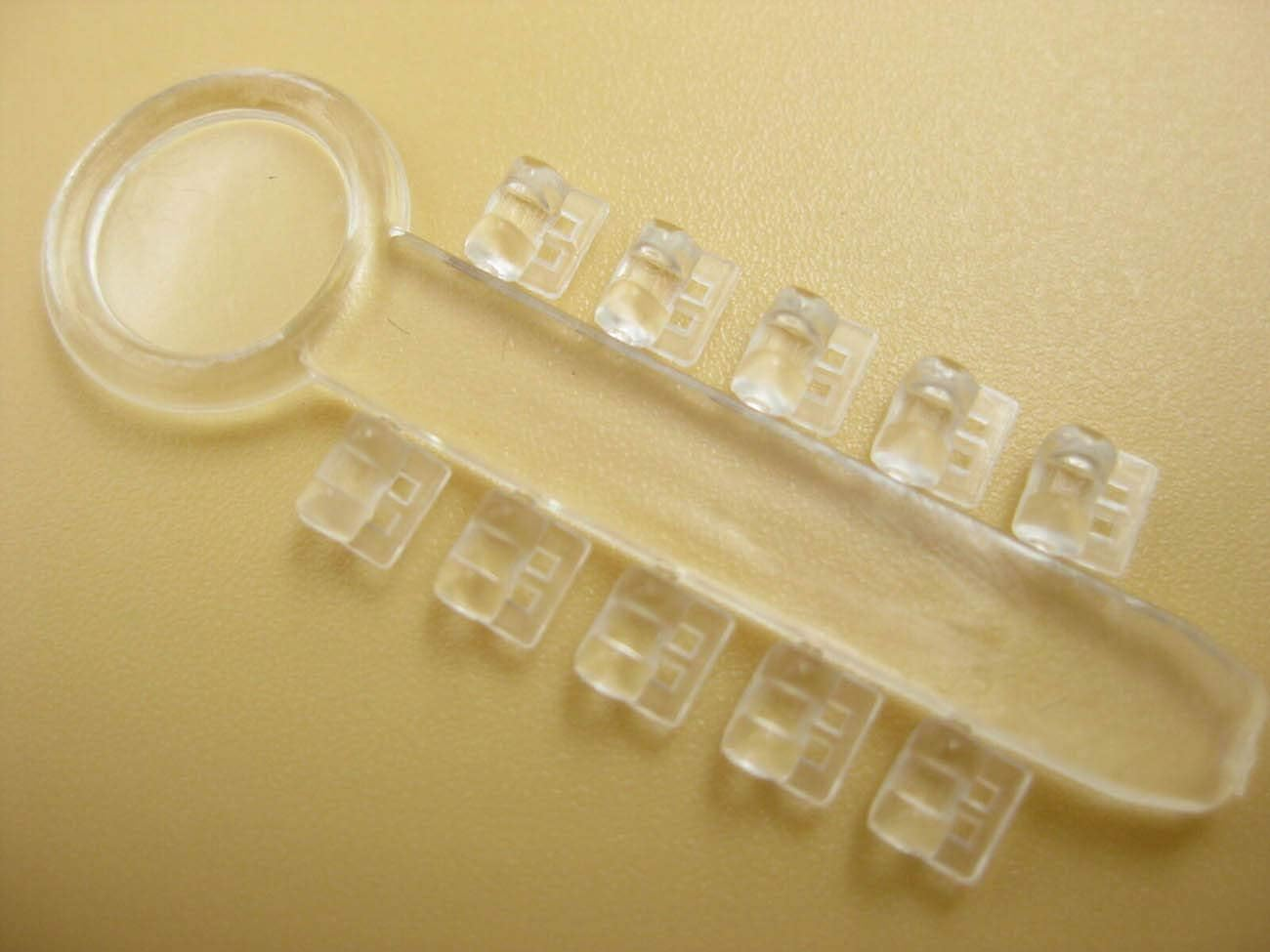 100Pcs Orthodontic Rotation Wedges Ligature Rotary Pad Dental Elastic Rubber Bands (Clear) image number 3
