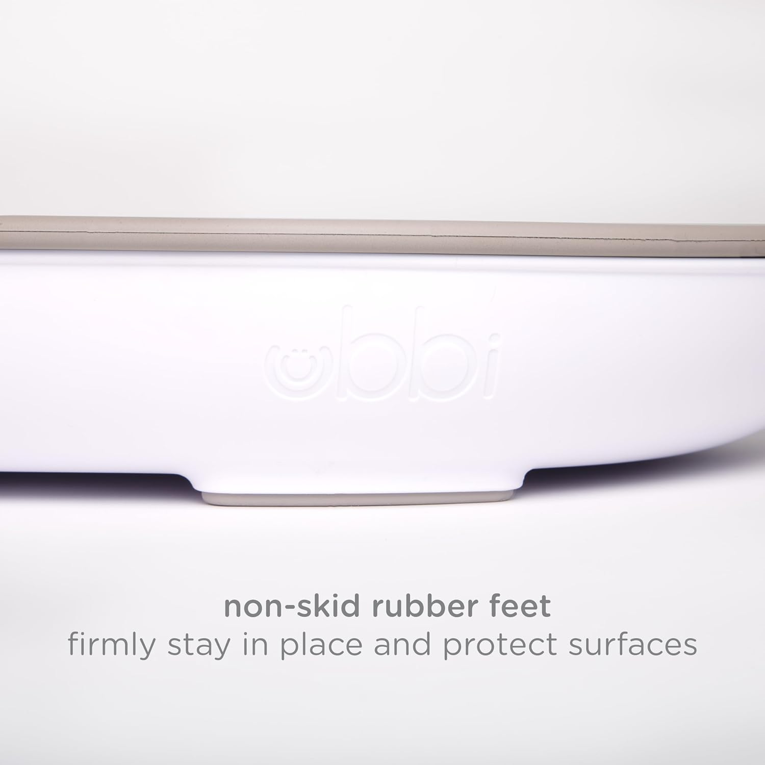 Ubbi Baby Changing Pad, Easy to Clean with Detachable Base, Lightweight, Waterproof Foam, Includes Safety Strap and Non-Skid Feet, Taupe image number 5