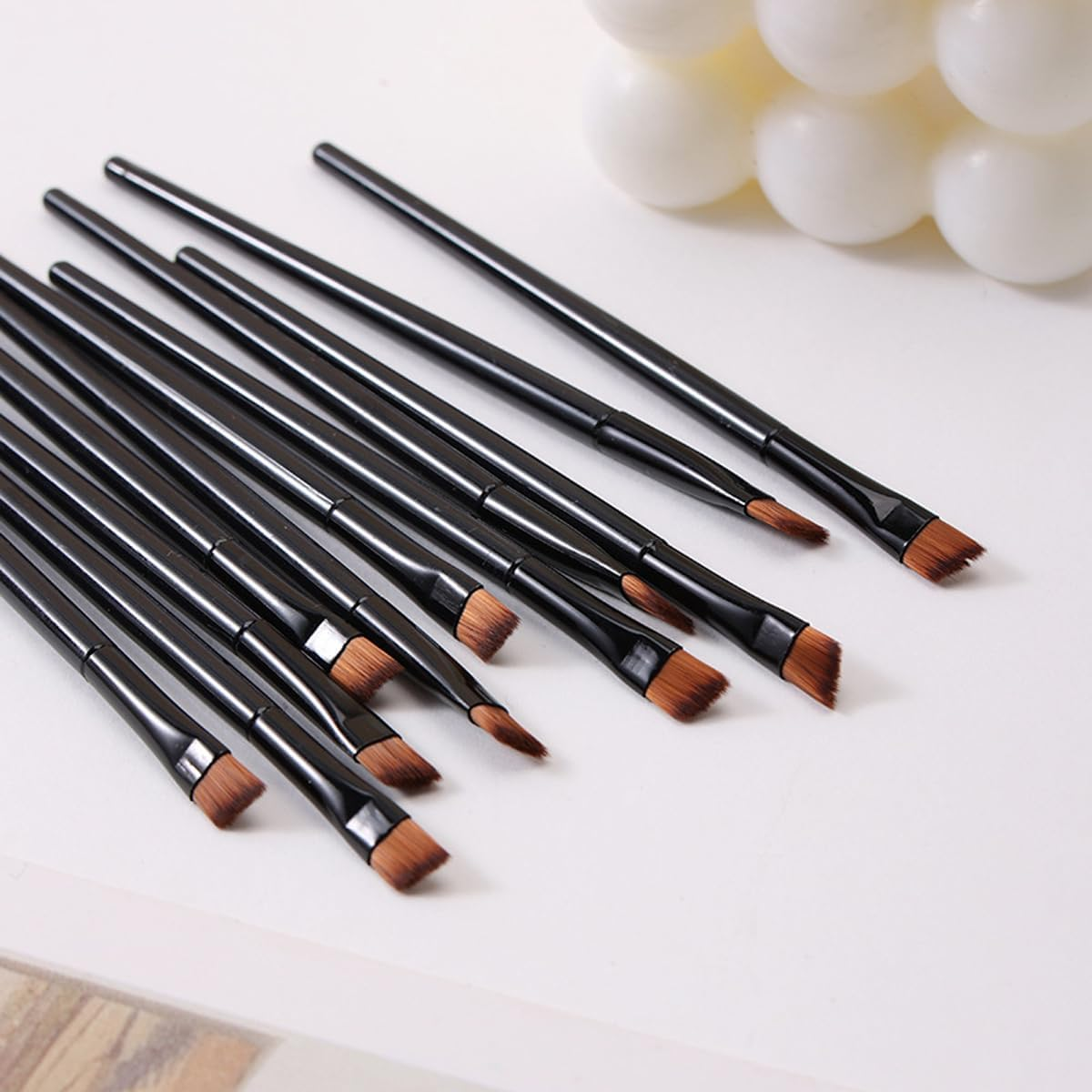 100 PCS Compact Eyebrow, Lip, and Eye Shadow Makeup Brush with Angled Tip, 10Cm Length, Black Plastic Handle, Portable Beauty Tool for Precise Application image number 4