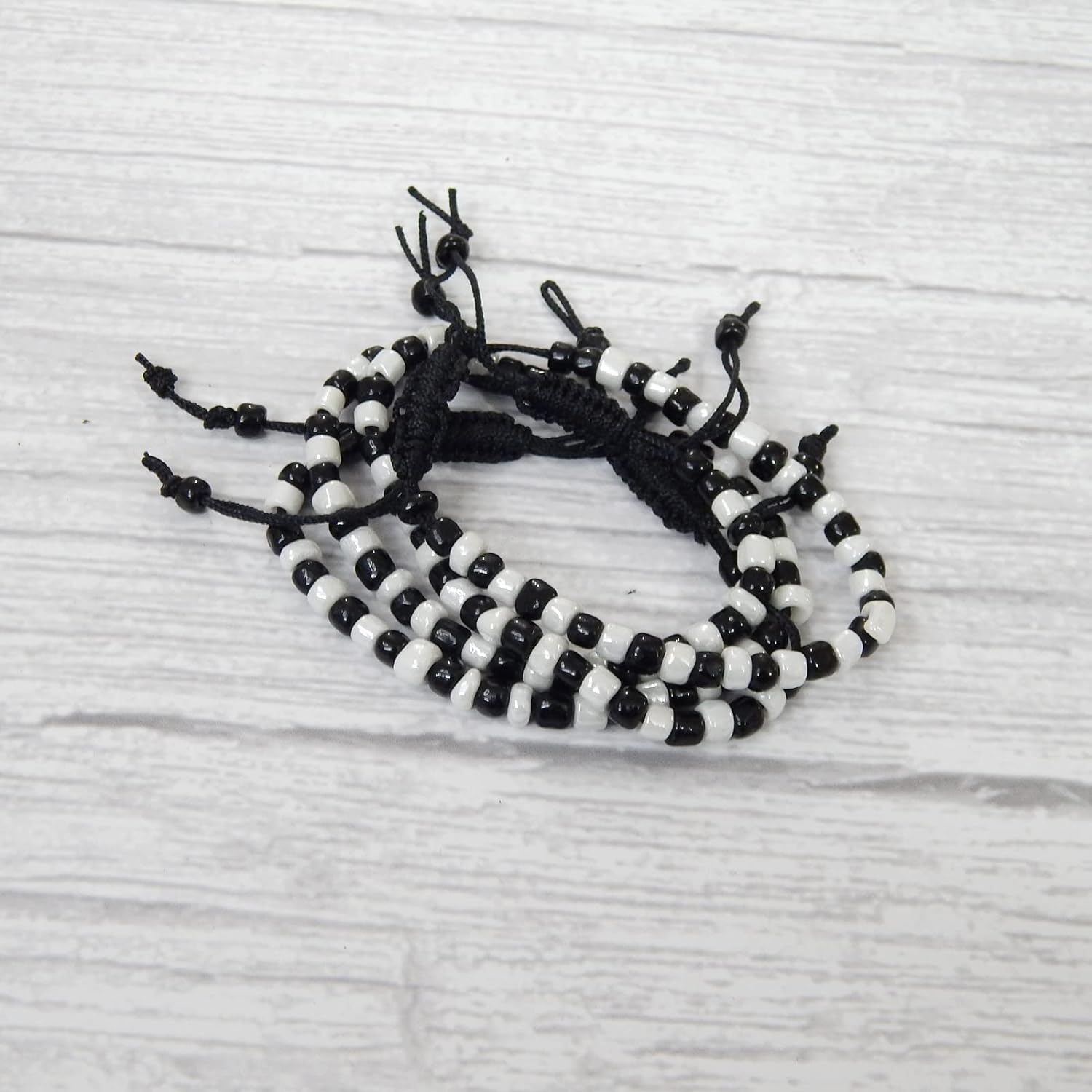 Black & White Nazariya for Baby Girls & Baby Boys (2 Pair) - Adjustable Size Cotton Thread Black Evil Eye Nazar Bracelet for Hands & Foot for New Born Babies by Co Creative image number 4