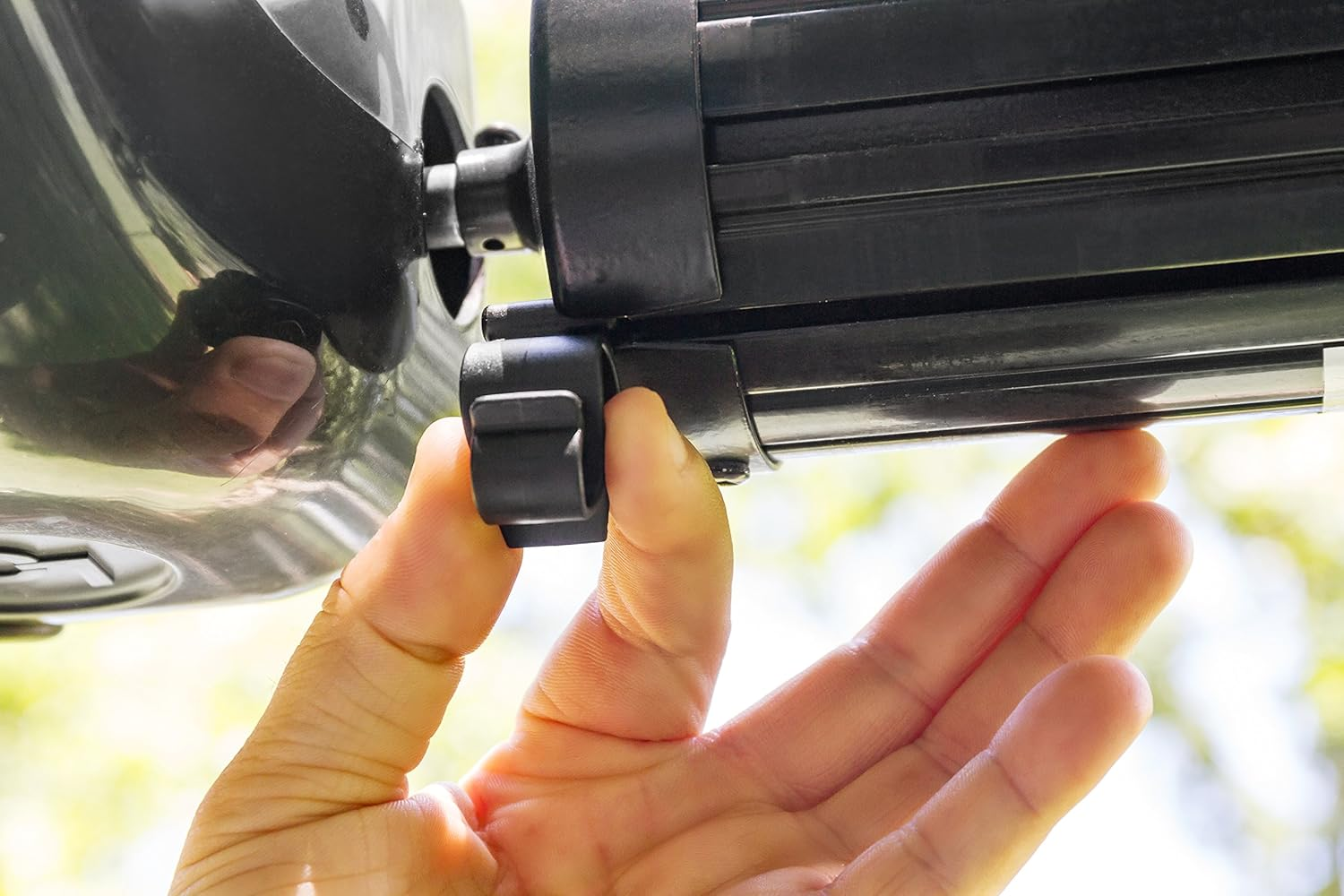 Camco Black Standard Awning Clip for Rope Light - Slides into Awning Roller Bar Channel to Create a Convenient Hook | Two Hanging Positions | Holds Party Lights, RV Lights, String Lights - (42708) image number 1