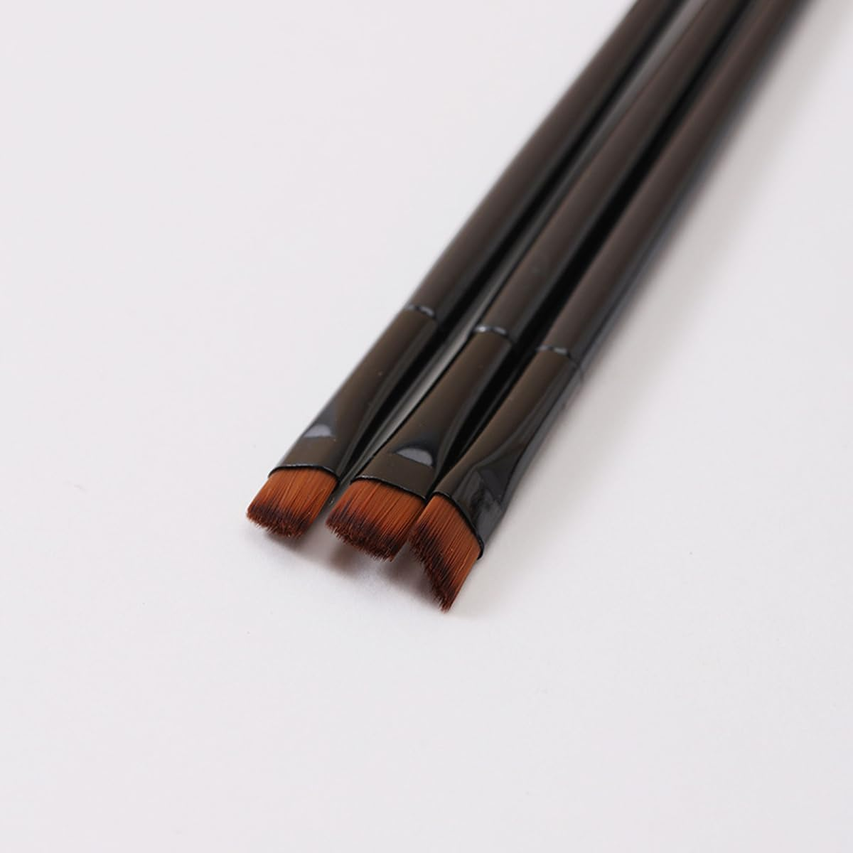 100 PCS Compact Eyebrow, Lip, and Eye Shadow Makeup Brush with Angled Tip, 10Cm Length, Black Plastic Handle, Portable Beauty Tool for Precise Application image number 5